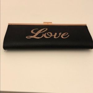 Clutch black purse with Bronze outline